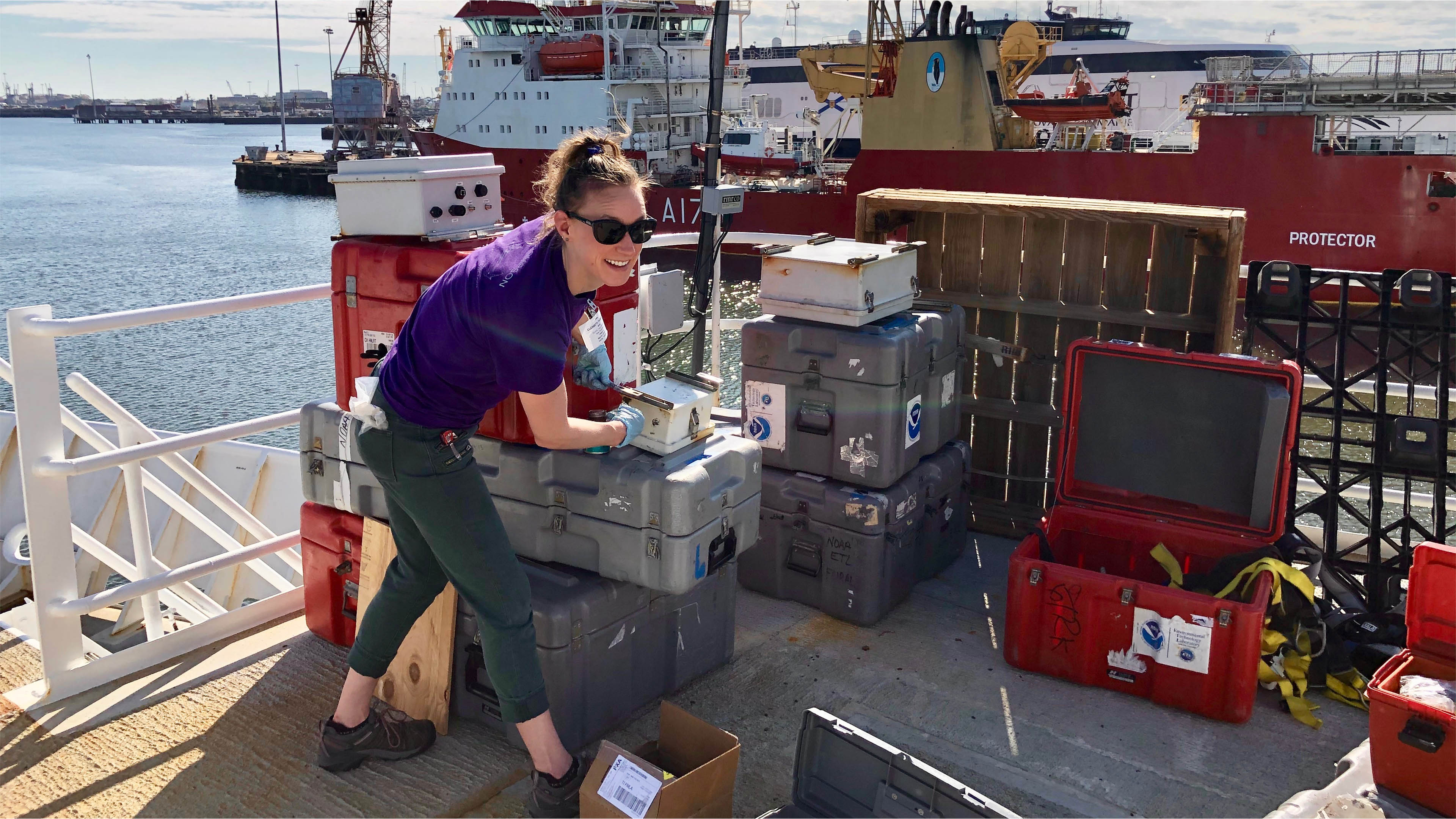 Elizabeth Thompson (PSD) installs equipment aboard the NOAA Ship Ronald H. Brown prior to the campaign