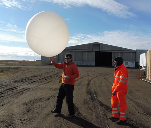 Gijs (left) launches a weather balloon in Oliktok Point, Alaska