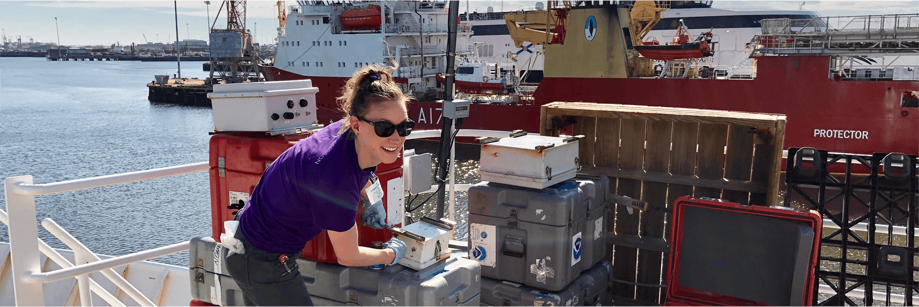 Researcher Elizabeth Thompson installing equipment aboard the NOAA Ship Ronald H. Brown in preparation for ATOMIC. Credit: NOAA