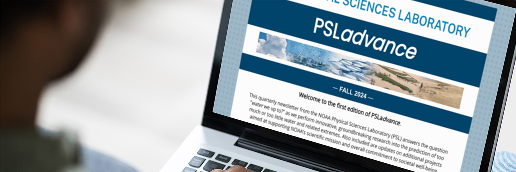 A person with a laptop on their lap with the screen showing a PSL newsletter