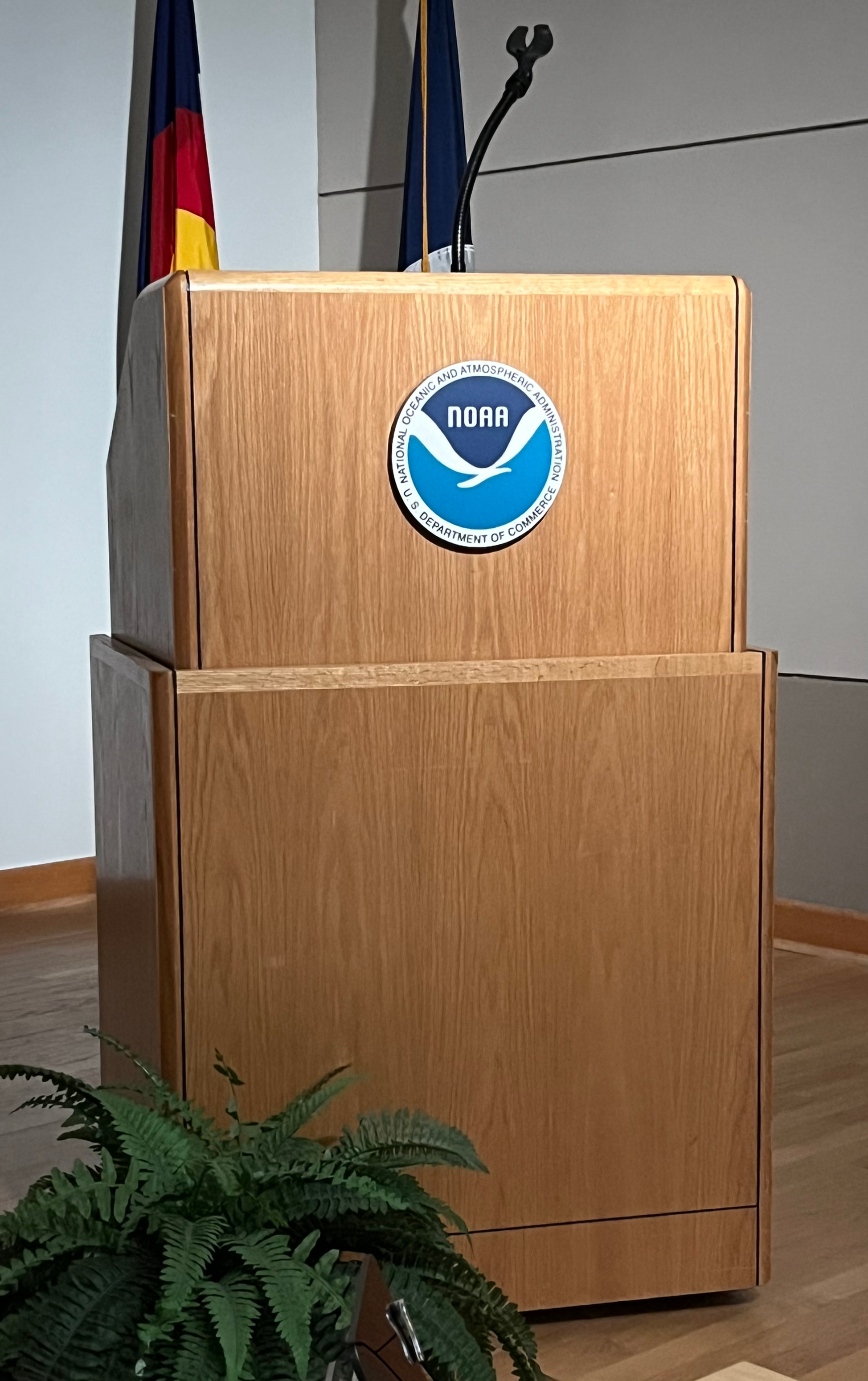 Wood podium with NOAA logo on front