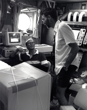 Chris Fairall and colleague monitoring flux system computers on research cruise in the early 1990s.