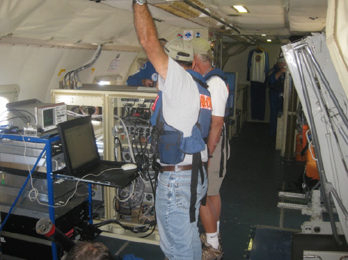 Sergio Pezoa and Ken Moran checking out the ESRL W-band radar during test flights on the NOAA P-3 near Tampa, FL. Credit: Chris Fairall, NOAA